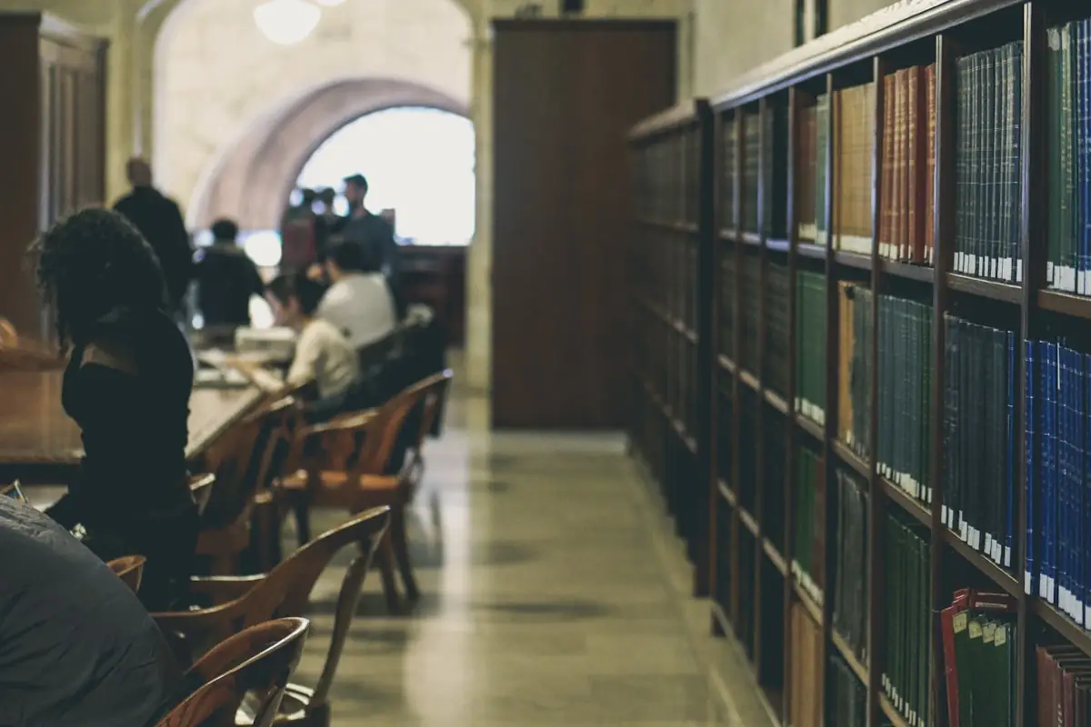 Quiet library aisle for comparing book trackers